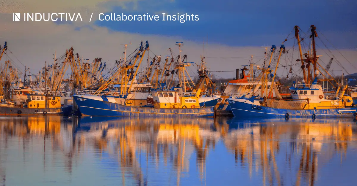 Group of fishing boats floating on calm water